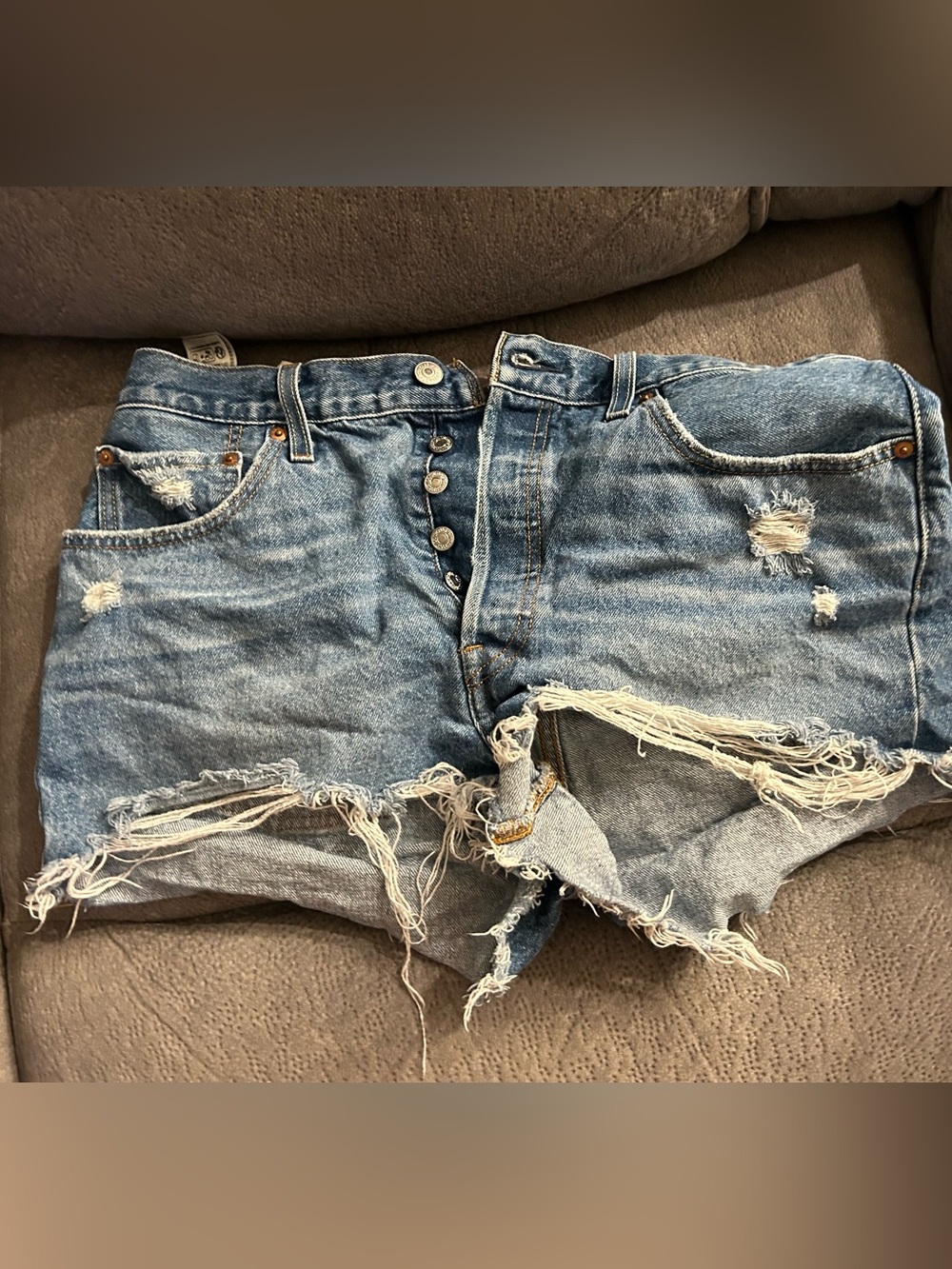 Levi’s Distressed Light Blue Denim Cutoff Shorts